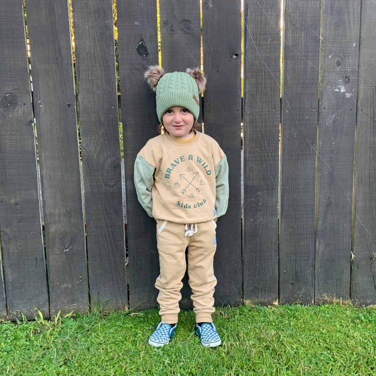Beige kids track pants in soft French Terry with relaxed fit with a green double pompom beaning - Stick Hunters