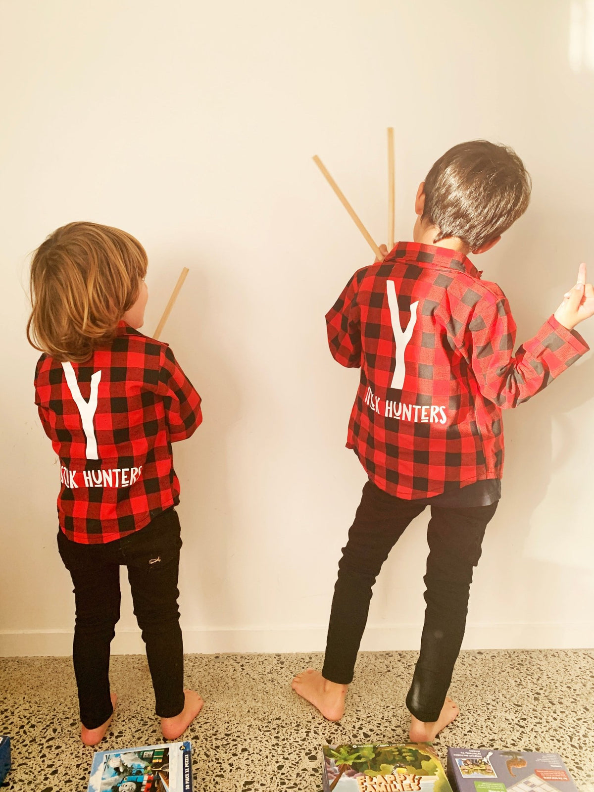 Back view of red plaid kids shirt showing graphic print - Stick Hunters
