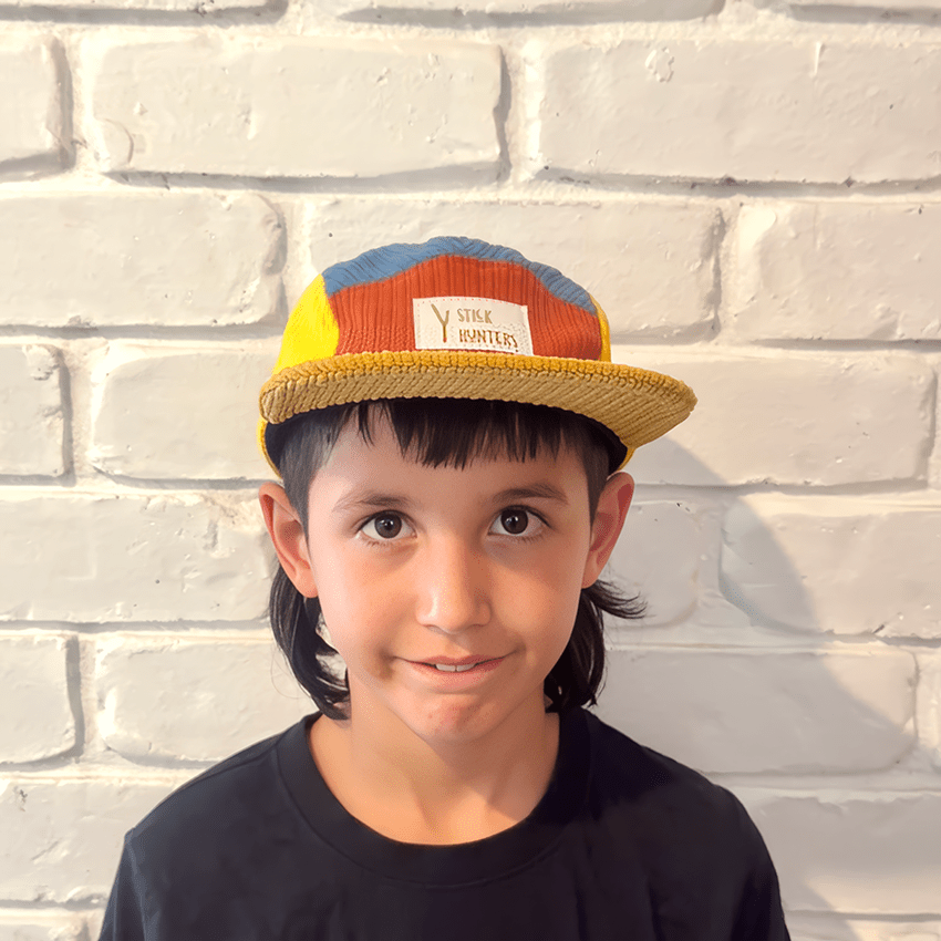 Boy wearing family matching corduroy 5 panel cap in primary colours - baby to adult sizing - Stick Hunters